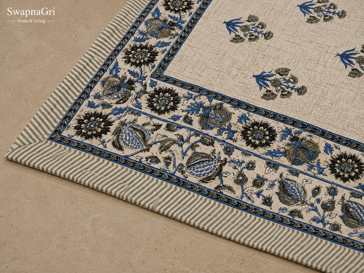 Close-up of SwapnaGri cream and blue floral cotton bedsheet matching pillow covers