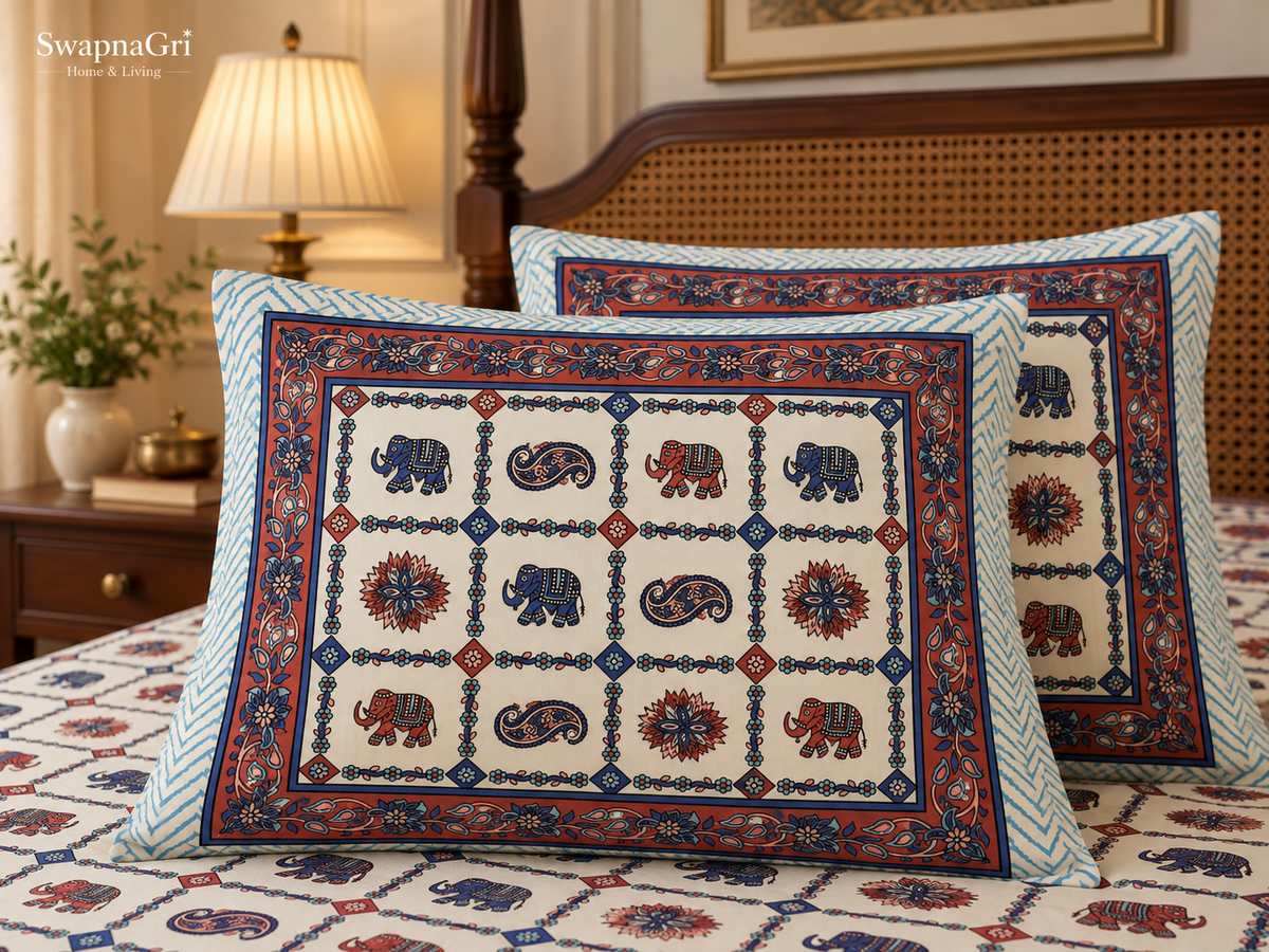 Detailed view of the coral and blue decorative border and folk-art elephant procession print
