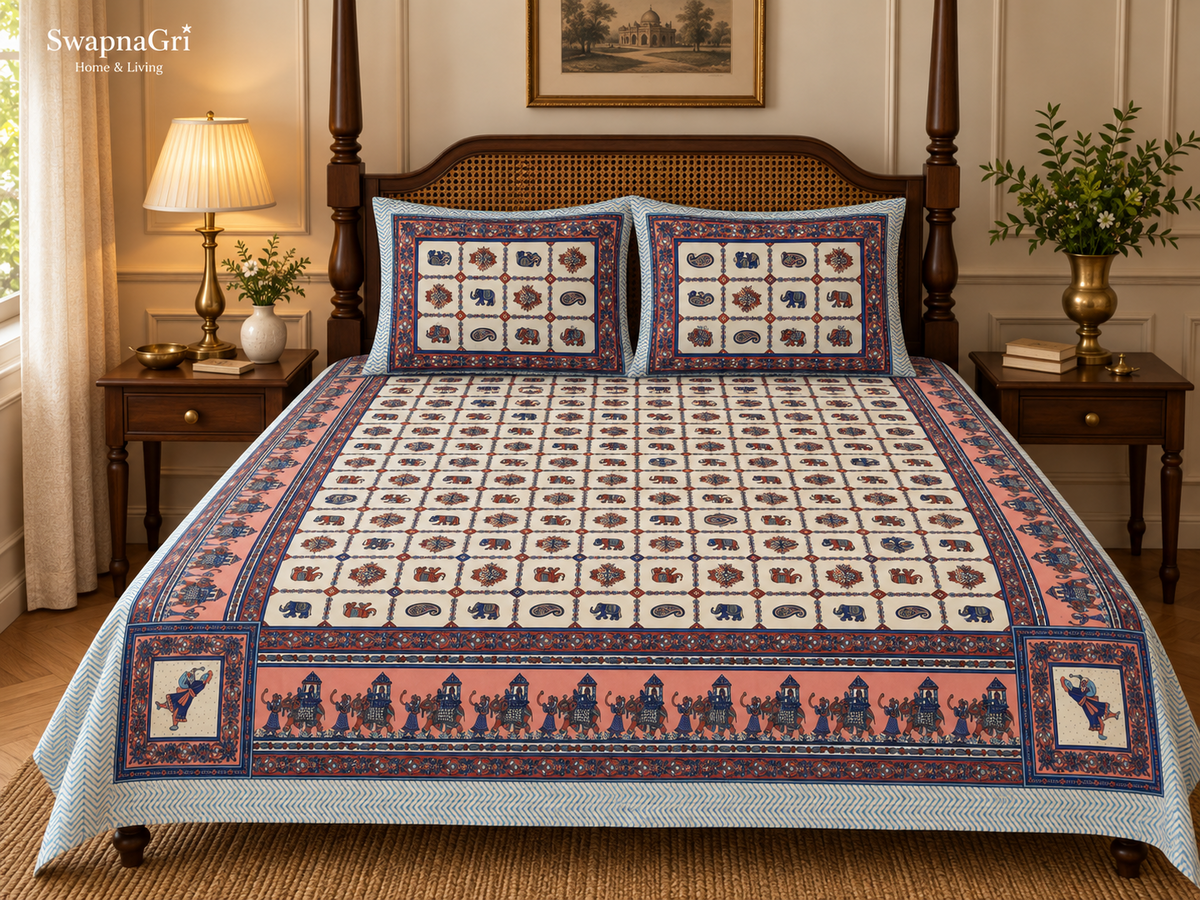 Matching blue cream and coral ethnic printed pillow covers styled on the queen-size cotton bedsheet