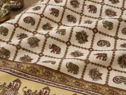 Detailed view of decorative border and folk elephant motifs on cotton bedsheet