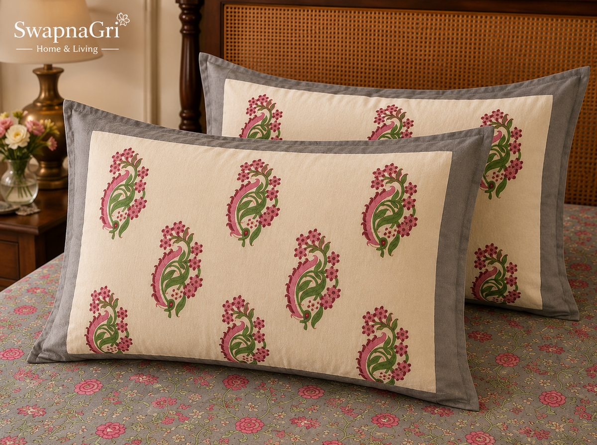 Close-up of SwapnaGri grey and pink paisley floral pillow covers and bedsheet