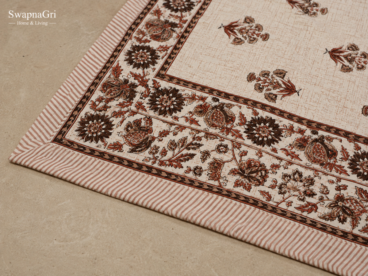 Close-up of SwapnaGri rust and brown floral cotton bedsheet border, pattern and fabric detail